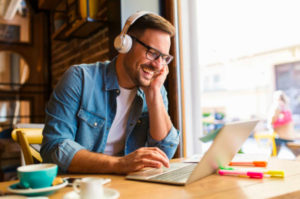 Man using computer at coffee shop