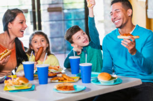 A family enjoying a fast food meal